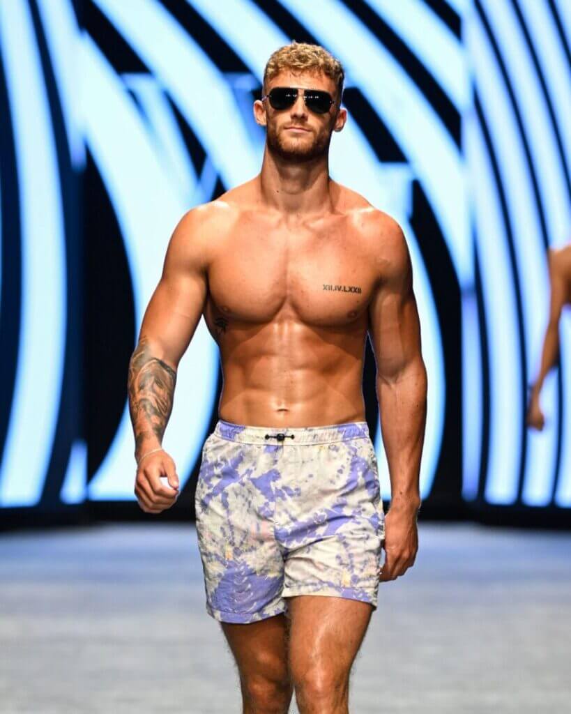 Model in floral swim trunks on the runway