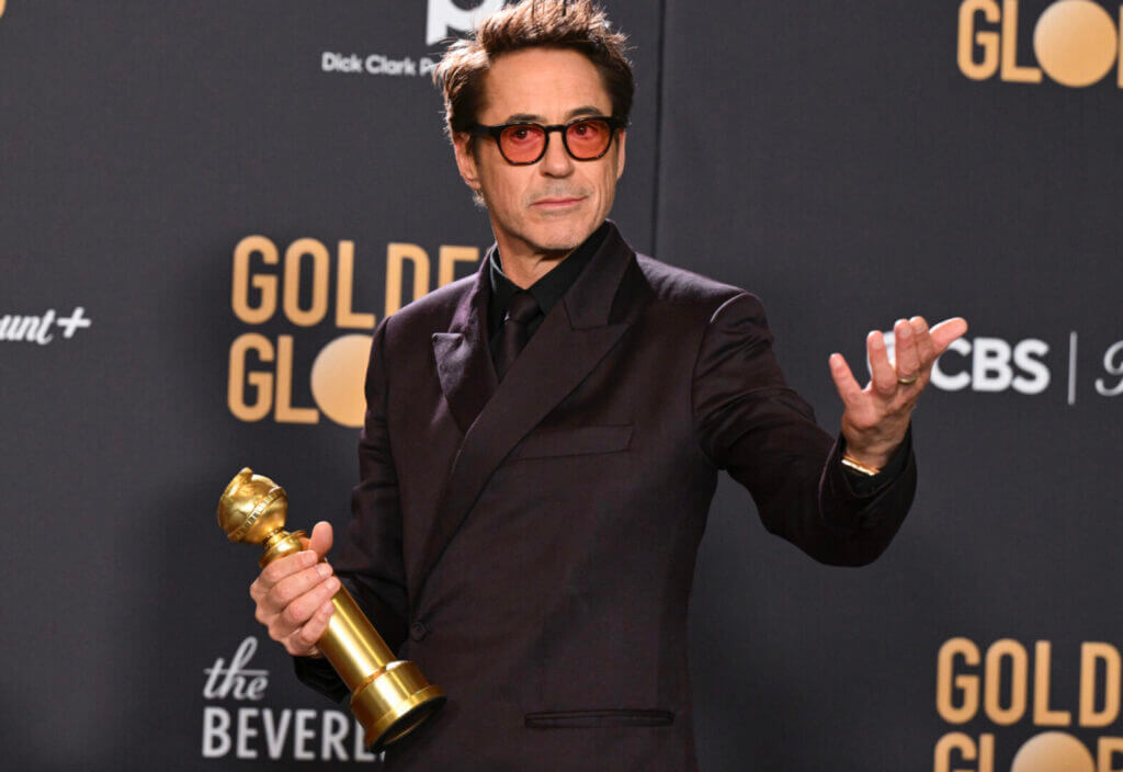 Actor holding a Golden Globe award