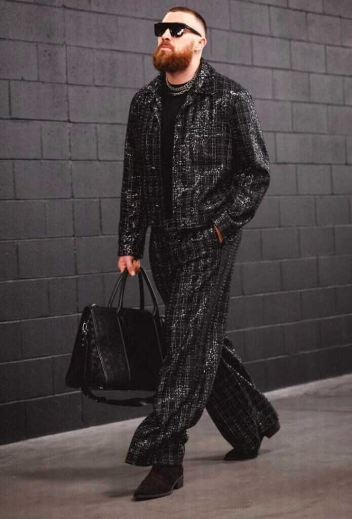 Man in a dark outfit walking