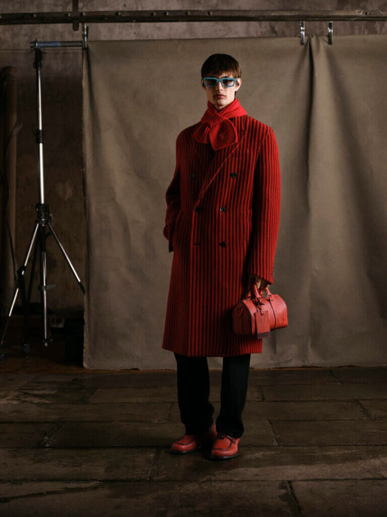 Model in a long red coat