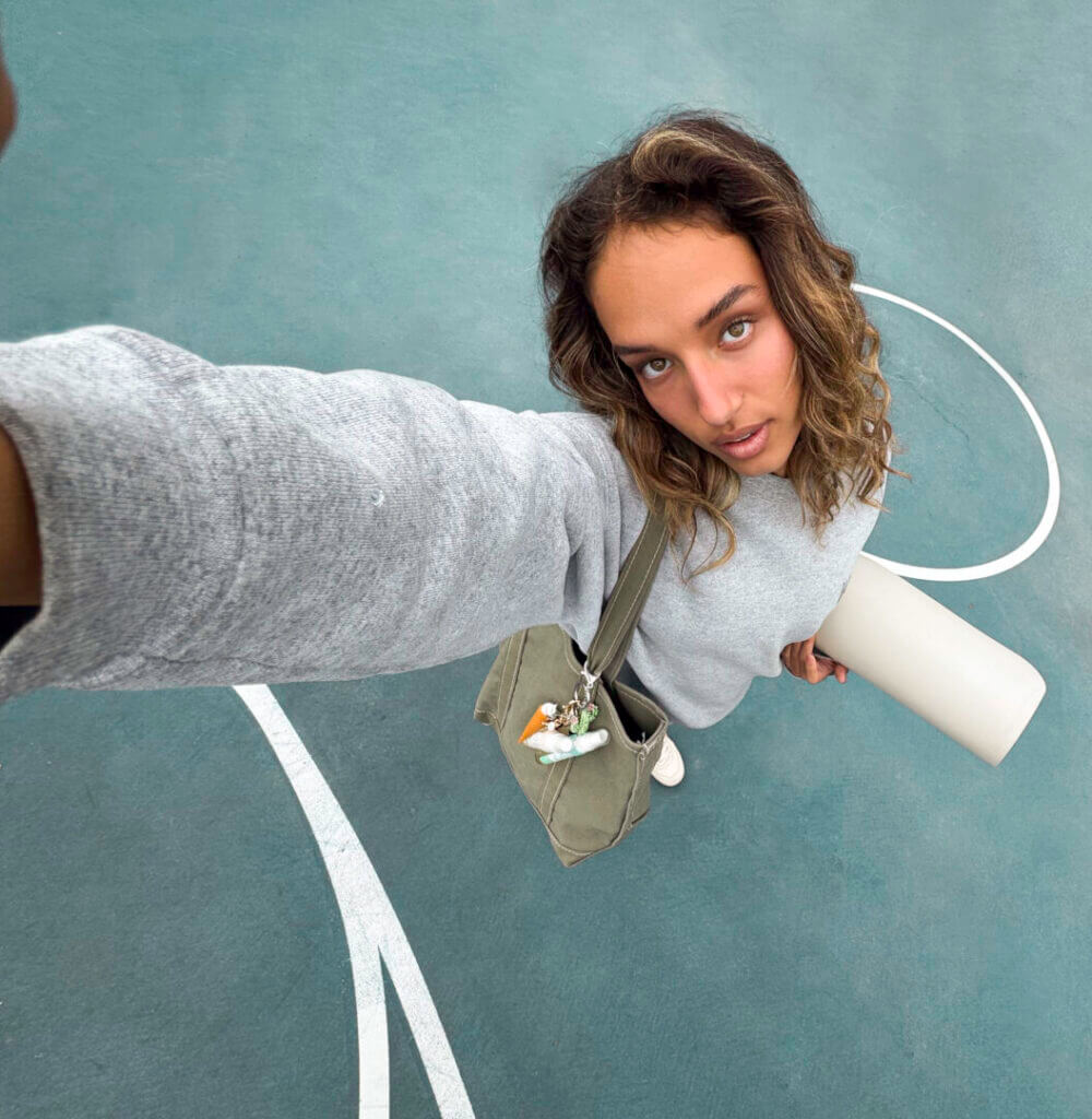 Woman holding a skincare tube