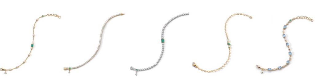 Row of delicate gold chain bracelets