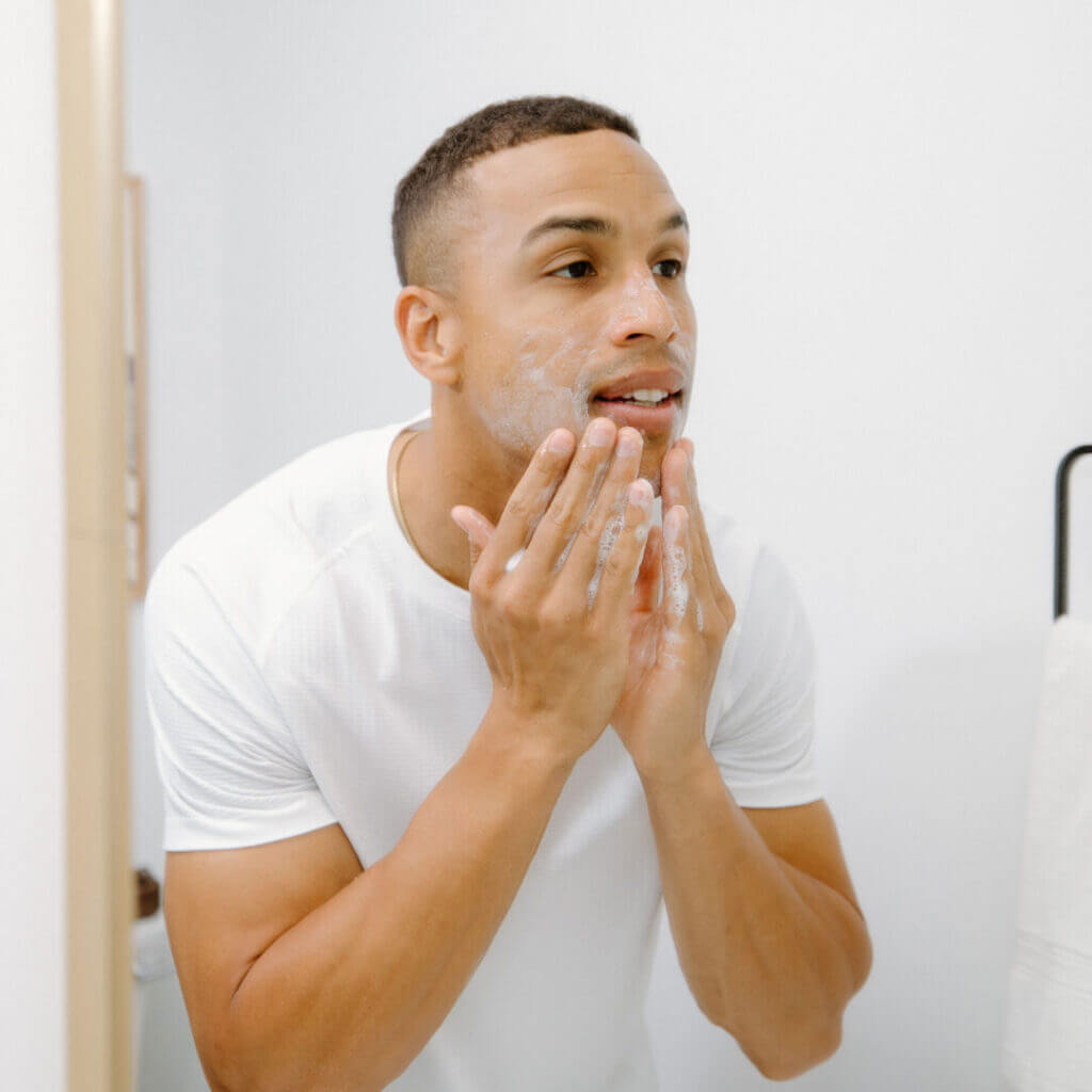 Man washing his face