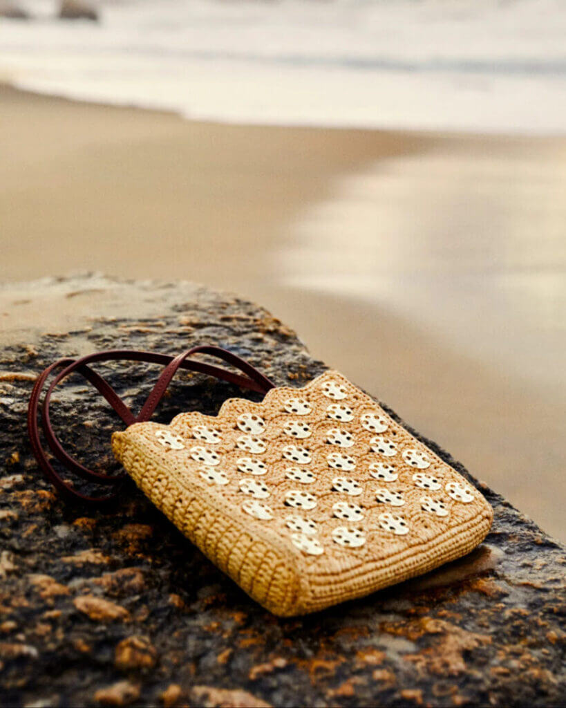 Woven gold clutch on a rock