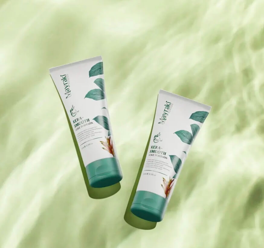 Two skincare tubes on green