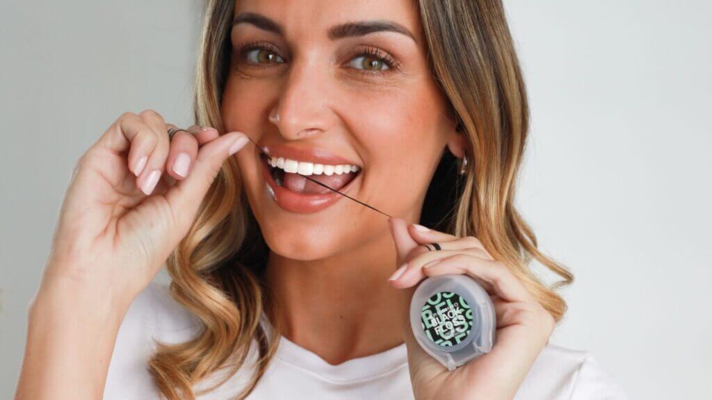 Smiling woman holding a grooming device