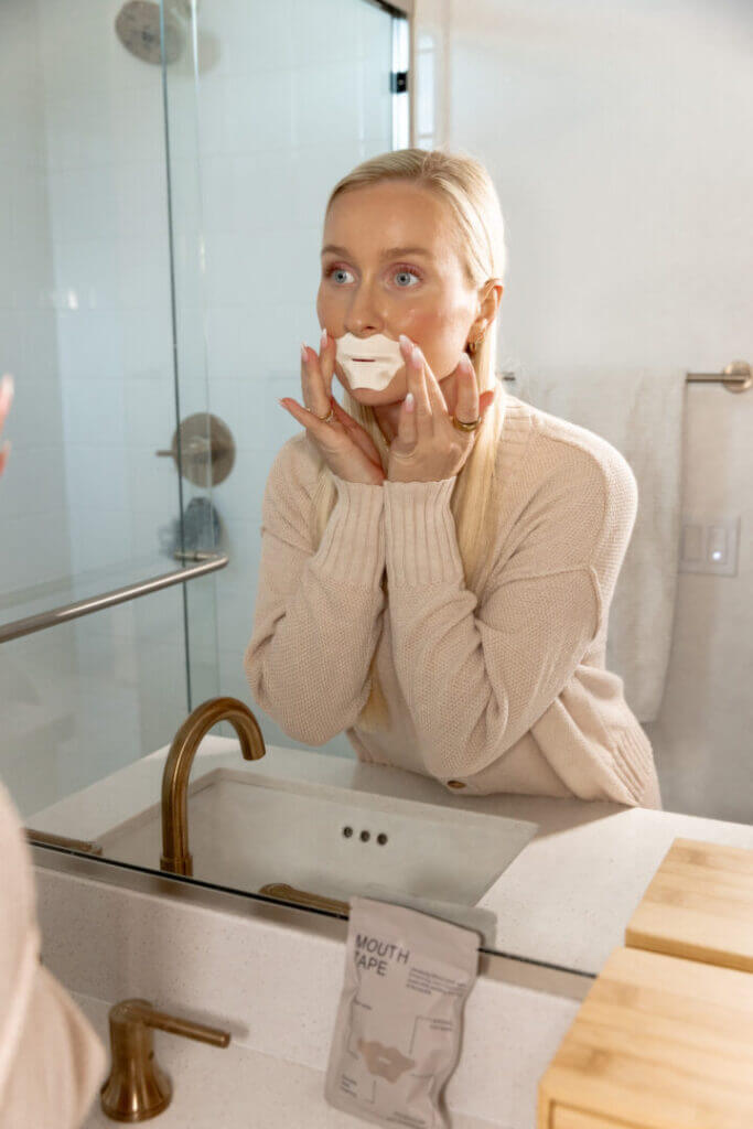 Woman at a bathroom mirror