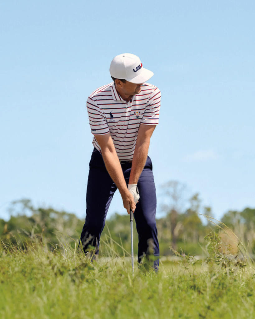 Golfer swinging on a course
