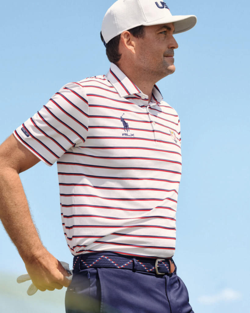 Golfer in a striped polo and white cap