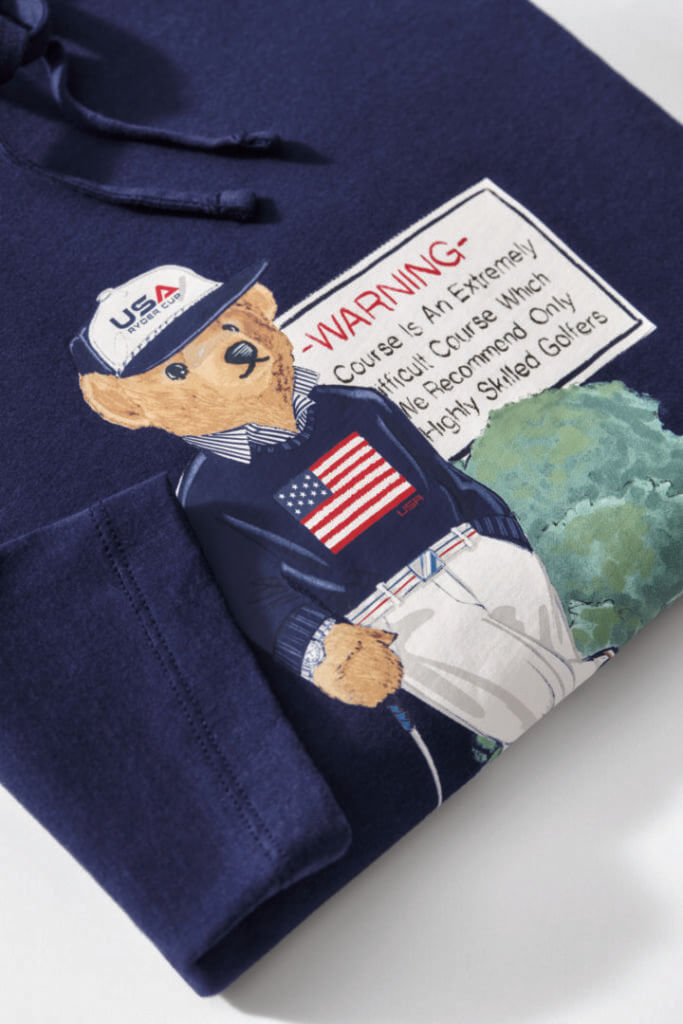 Navy sweater with a teddy bear golfer